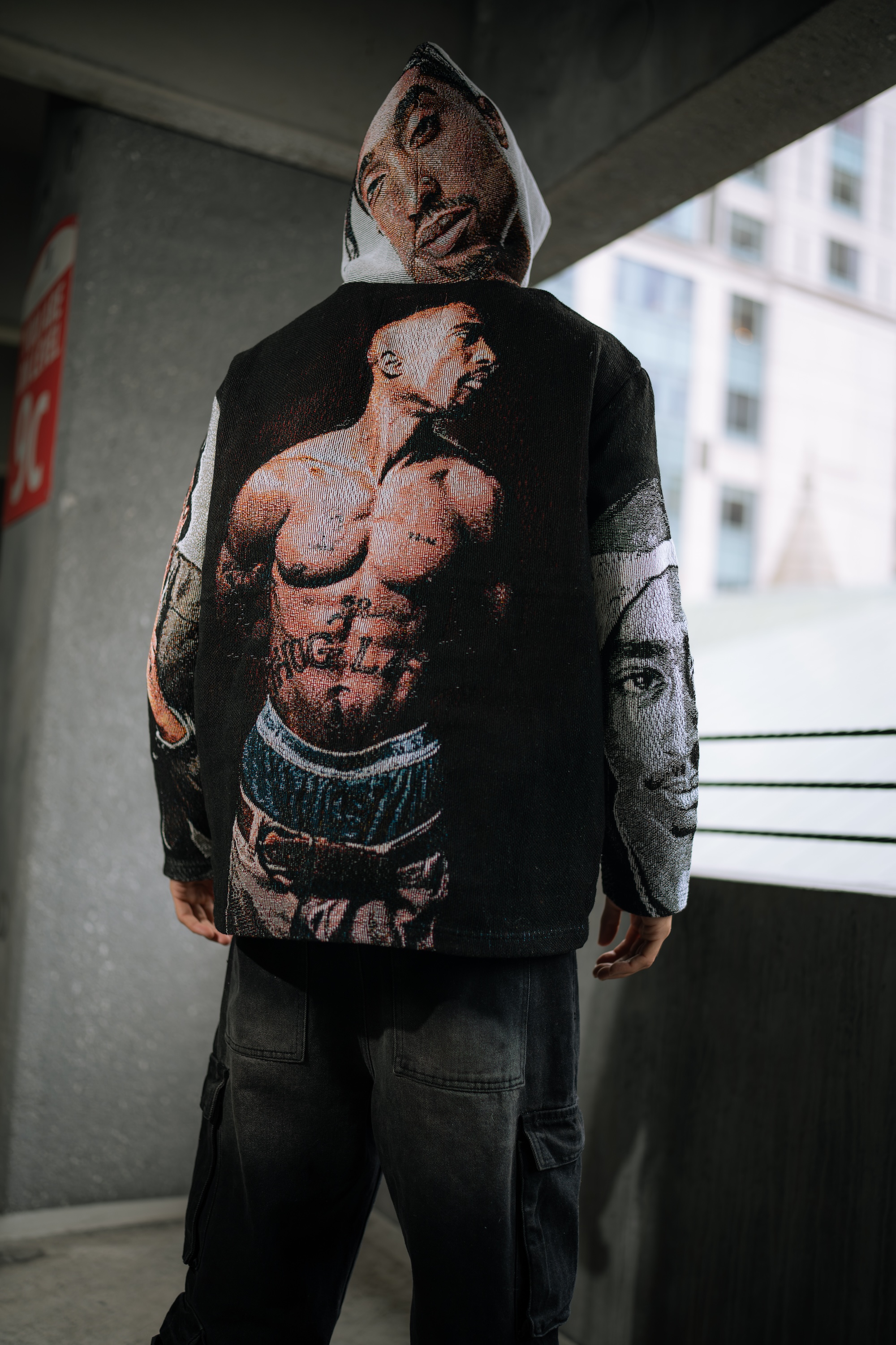 Byepound ambassador in a woven tapestry hoodie