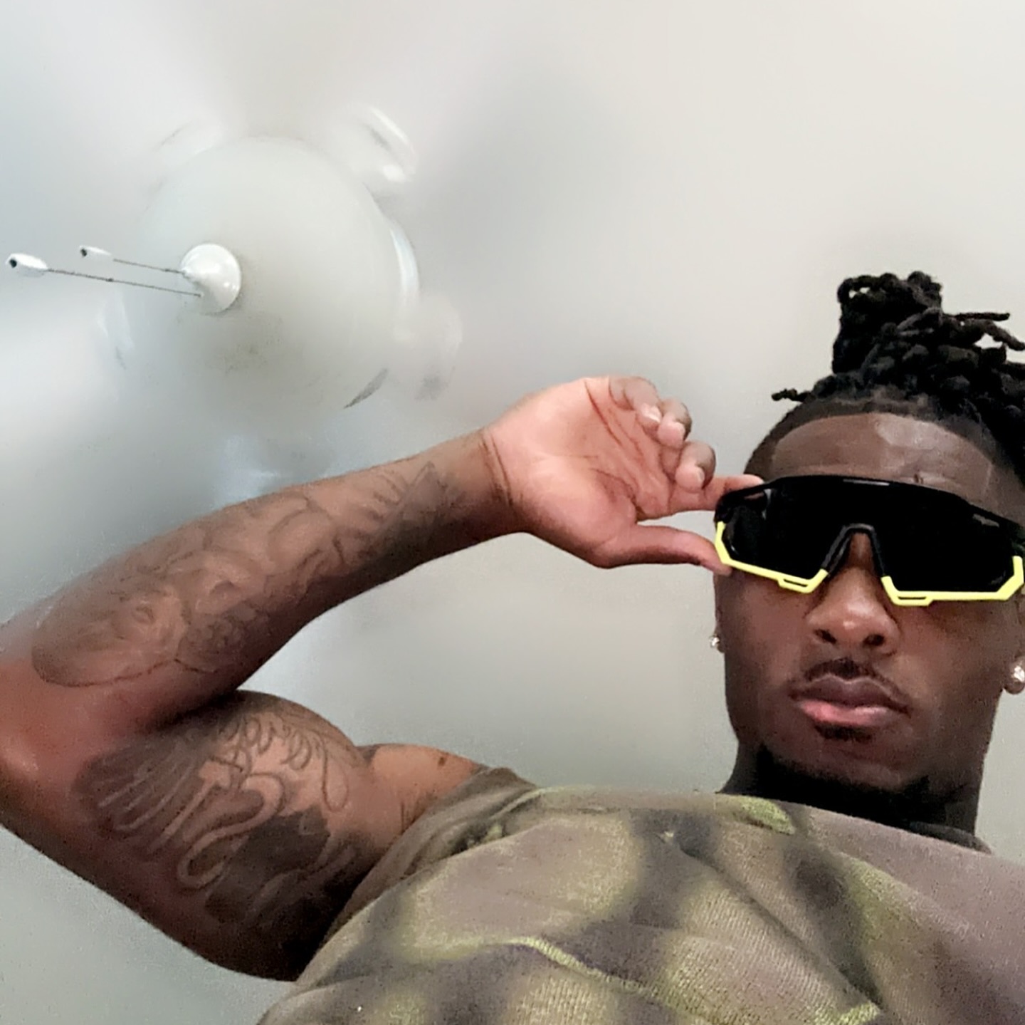 Customer wearing the yellow Marathon Shades sunglasses