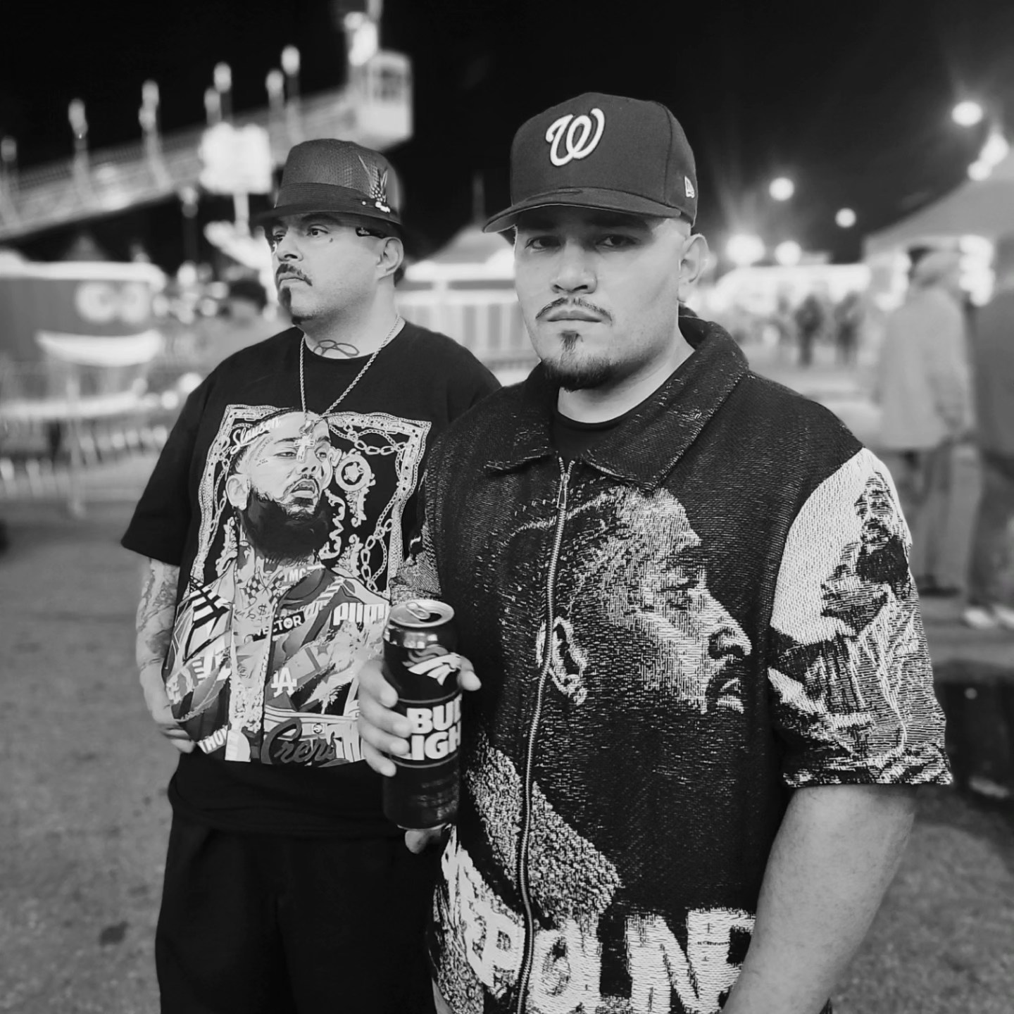 Customer rocking a Byepound Dept tapestry zip-up at a night fair