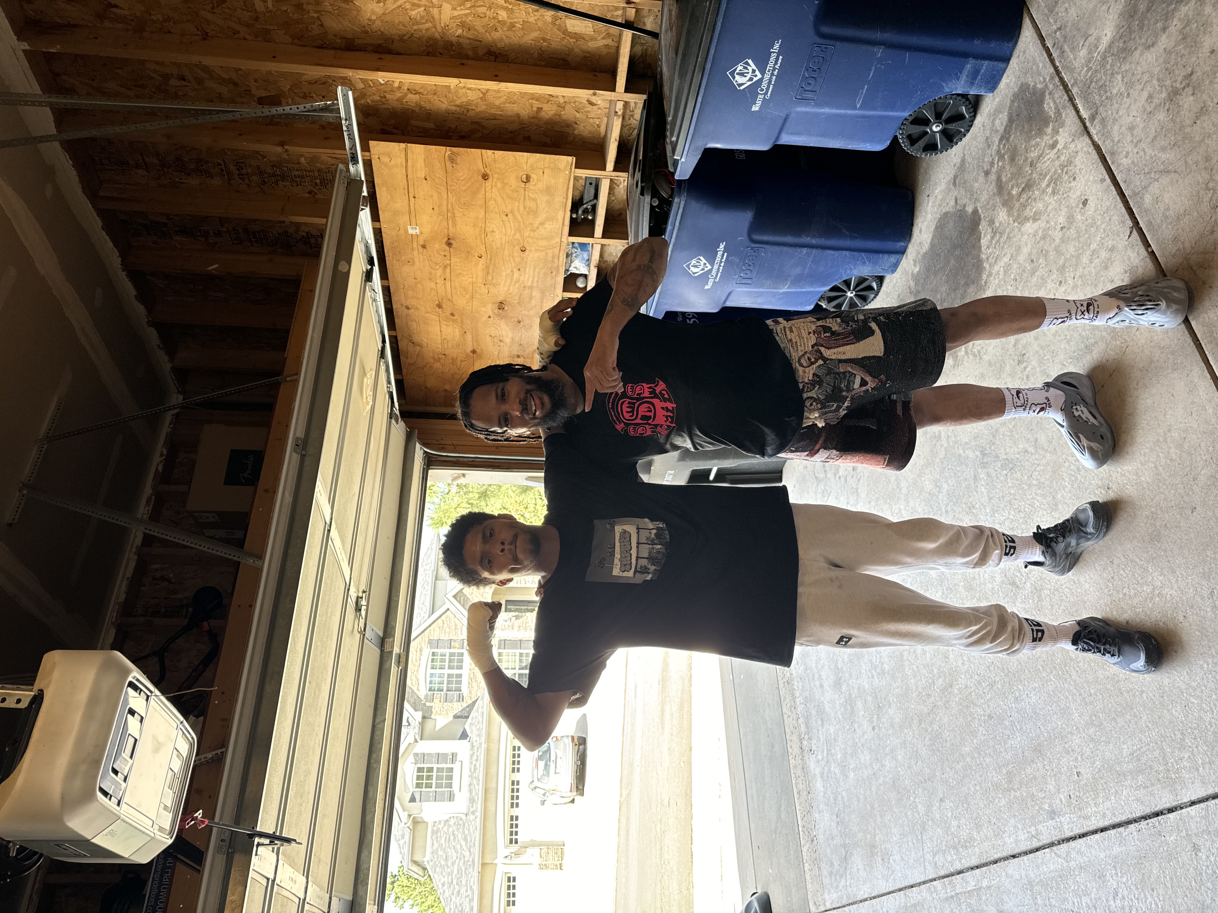 Customer styling Byepound Dept tapestry shorts in the garage